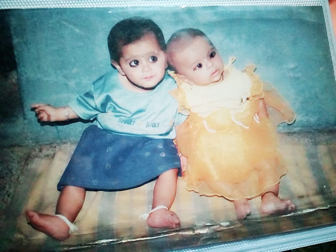 Riya as a toddler with her sibling